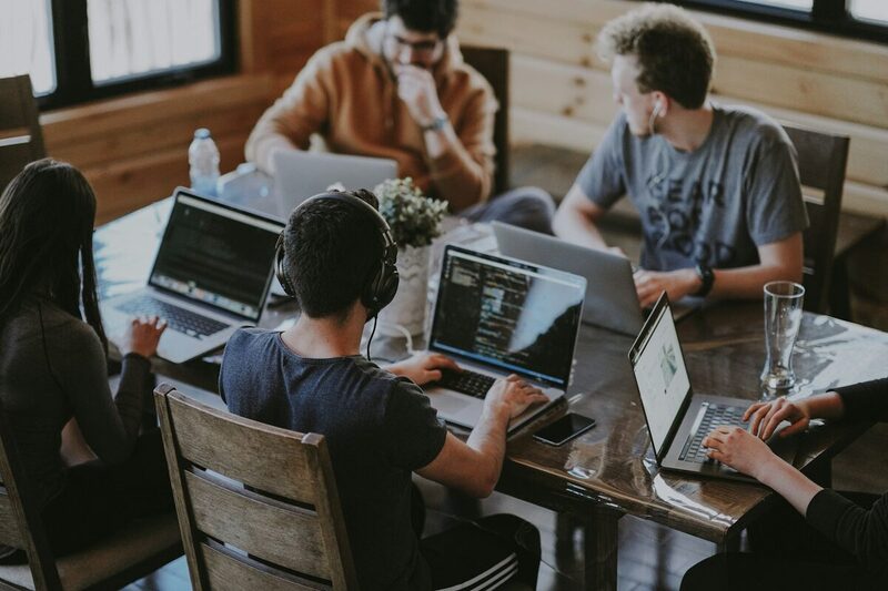 A young Miami marketing team working together on a campaign