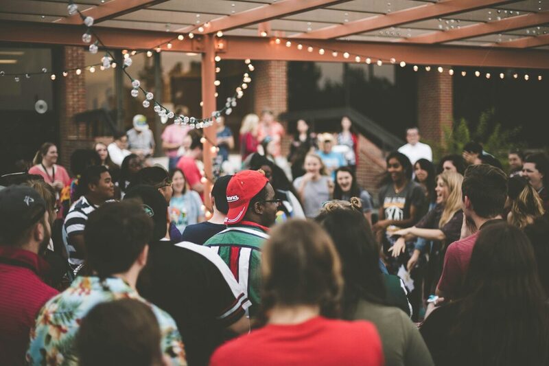 Guests networking at a busy indoor brand event in Miami