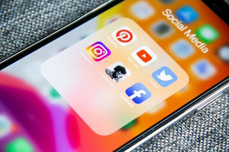 Smartphone home screen showing a folder of social media applications