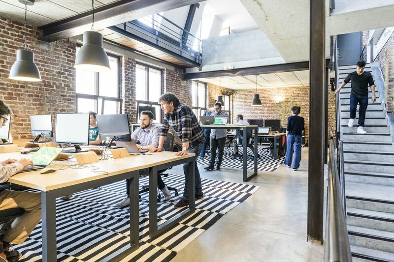 An open-plan Miami workspace where the online presence team works